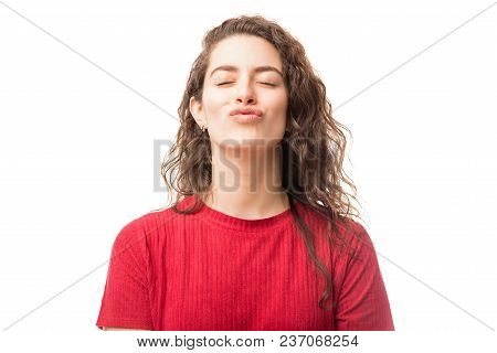 Pretty Romantic Female Closing Eyes With Puckered Lips