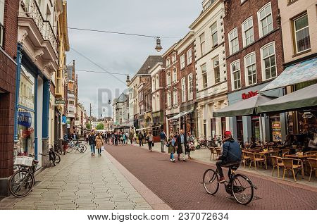 S-hertogenbosch, Southern Netherlands - July 01, 2017. Street With Restaurants, Shops, Cyclist And P