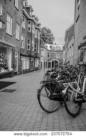 S-hertogenbosch, Southern Netherlands - July 01, 2017. Several Bikes Stopped At The Alley Entrance I
