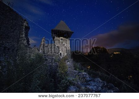 Ruins Of Nevitsky Castle Near Uzhgorod, Ukraine With A Lot Of Shiny Stars On The Dark Blue Sky