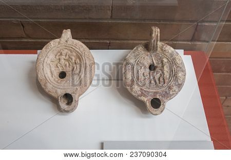 Merida, Spain - December 20th, 2017: Two Clay Oil Lamps With Erotic Motifs At National Museum Of Rom