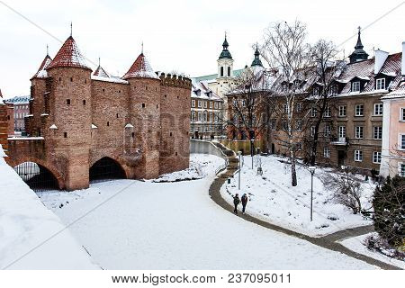 Warsaw Barbacan Fortress Castle In Winter Is In The Capital City Of Poland. Old Town Is The Historic