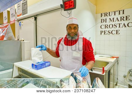 ROME, ITALY - CIRCA NOVEMBER 2017: indoor portrait of staff in Conad supermarket in Rome.