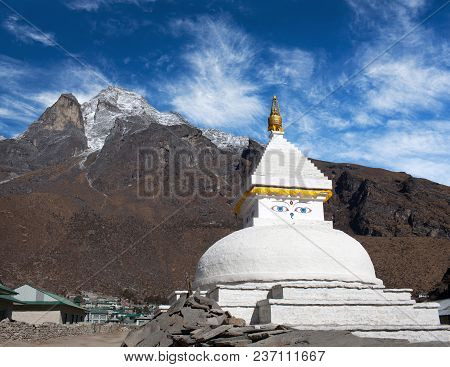Mount Khumbila And Buddhist White Stupa Near Khumjung Village On The Way To Everest Base Camp, Khumb