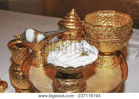 SPA concept, fresh of red rose petal in the clay pot which decorated with traditional coconut spoon.