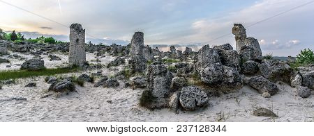 Magnificent Landscape Of Abstract Stones On A Hill At Sunset.