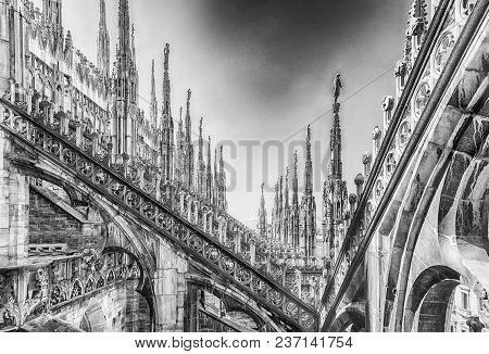 Detail With Marble Spiers And Statues On The Roof Of The Gothic Cathedral Of Milan, Italy