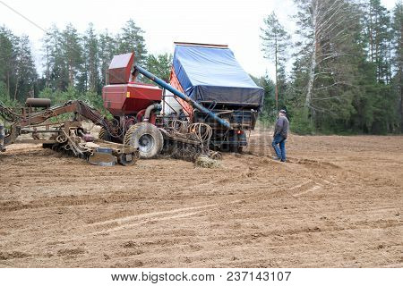 Sowing Unit, Combine Harvester, Seeder And Lorry, Dumper On The Field.
