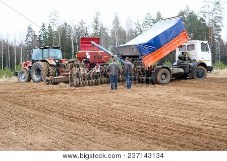 Sowing Unit, Combine Harvester, Seeder And Lorry, Dumper On The Field.