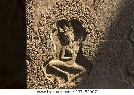 Dancing Apsara Bas-relief In Angkor Wat, Siem Reap, Cambodia. Ancient Dancer Sculpture. Angkor Wat T