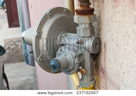 Gas Pipe Connection Close Up Shot On Residentual Building Wall.