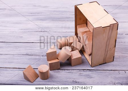 Educational Games For Children. Different Geometrical Figures On The Wooden Background. Entertaining