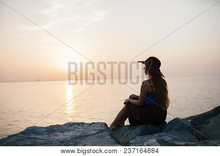 Beautiful Girl On A Sunset Background On A Sandy Beach. Woman.