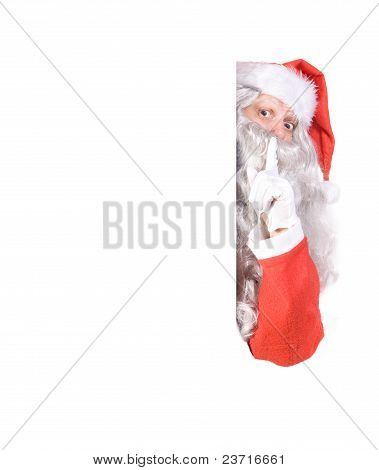 Santa Claus holding a blank sign
