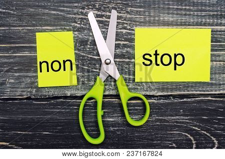 Concept Non Stop, Action, I Can, Goal Achievement, Potential, Overcoming. Scissors Cut The Word 