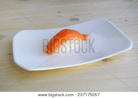 Sushi, Nigiri, Sake A Dish Of The Traditional Japanese Cuisine Cooked From Rice And A Salmon. Sushi 