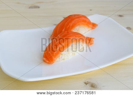 Sushi, Nigiri, Sake A Dish Of The Traditional Japanese Cuisine Cooked From Rice And A Salmon. Sushi 