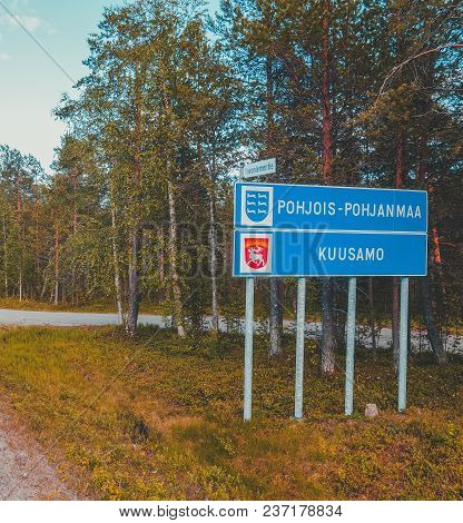 Finland, Road Sign On The Side Of The Road Telling Of Entering Pohjois-pohjanmaa And Kuusamo On Rova