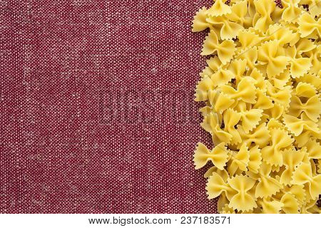 Farfalle Raw Farfallini Beautiful Decomposed Pasta With The Right, On Its Side On A Rustic Red-brown