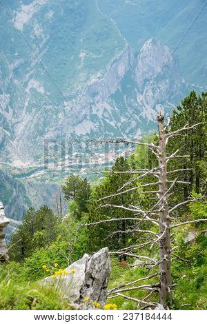 A Small Village Is At The Bottom Of A Deep Canyon