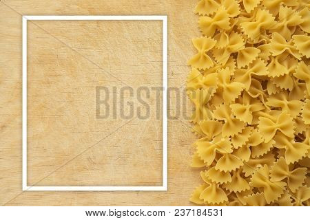 Farfalle Raw Farfallini Beautiful Laid Out Pasta With The Right, Side View On A Wooden Table Top Wit
