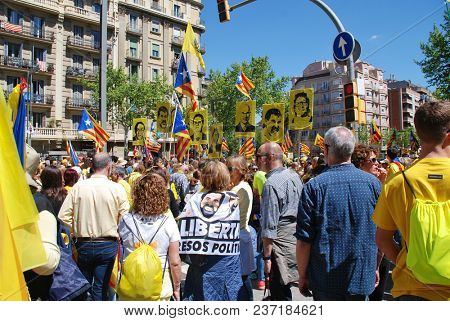 BARCELONA, SPAIN - APRIL 15, 2018: Catalans take part in the Llibertat Presos Politics (free political prisoners) protest march at Placa Espanya in support of jailed Catalan politicians.