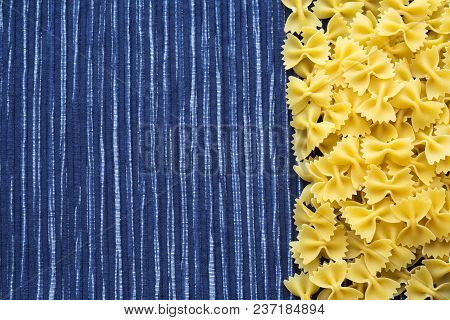 Farfalle Raw Farfallini Beautiful Decomposed Pasta With The Right, On Its Side On A Rustic Red-brown
