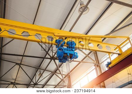 Hoist Of Industrial Overhead Crane In Factory. Close Up