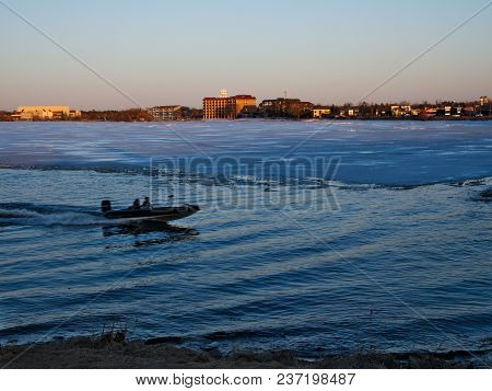 Fishing Boat Near Ice On Frozen Lake Bemidji At Sunset Minnesota
