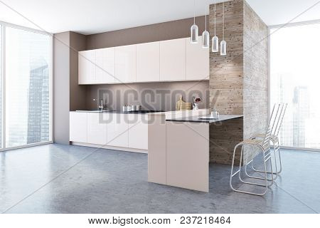 White Kitchen Corner With A Concrete Floor, White Countertops And Cupboards. A Beautiful Cityscape. 
