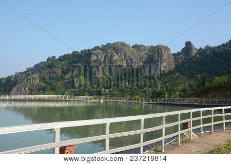 Panoramic Artificial Lake Embung Nglanggeran And Ancient Purba Mountain Nglanggeran As Far Backgroun