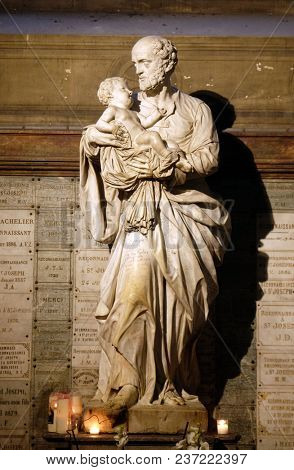 PARIS, FRANCE - JANUARY 10: Saint Joseph holding child Jesus, statue in the Saint Sulpice Church, Paris, France on January 10, 2018.