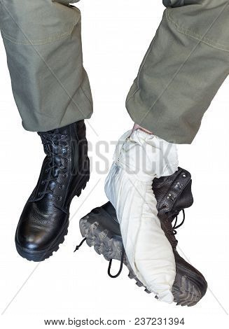 Two Legs Wearing Footcloths With Military High Burts Boots Isolated On White Background