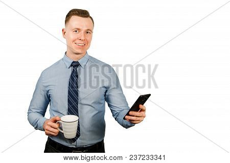 Young Businessman Dressed In Blue Shirt And Tie, Isolated On White Background