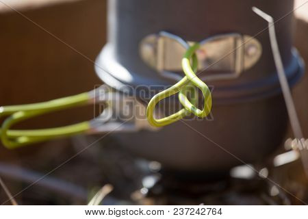 A Closeup Of A Boiling Pot On A Gas Primus Cooking Dinner For Hikers. Outdoors Kitchen.