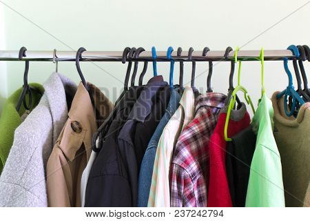 Different Clothes Hanging On Black And Blue Thrusters