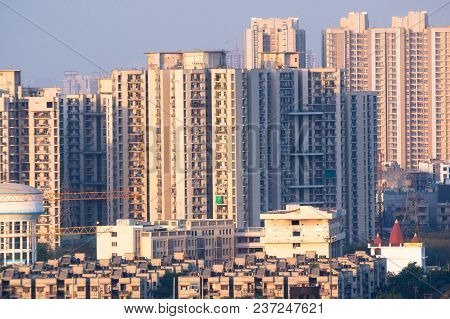 Cityscape With Skyscrapers Smaller Apartment, Water Tower Temple And Other Items. Typical In An Indi