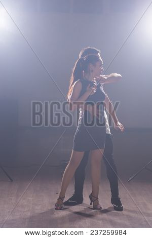 Young Couple Dancing Social Danse Kizomba Or Bachata Or Semba Or Taraxia In Dancing Class Background