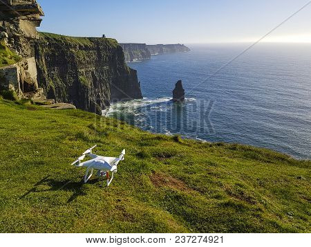 Beautiful Scenic Aerial Drone View Of Ireland Cliffs Of Moher In County Clare. Sunset Over The Cliff