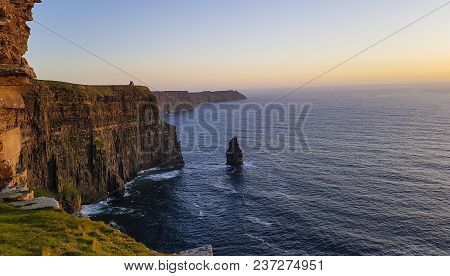 Beautiful Scenic Aerial Drone View Of Ireland Cliffs Of Moher In County Clare. Sunset Over The Cliff