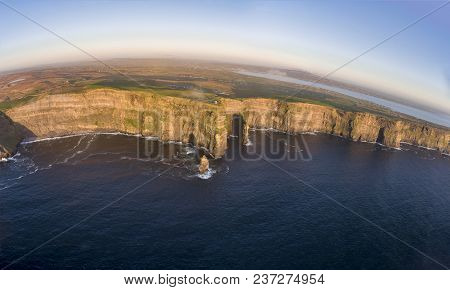 Beautiful Scenic Aerial Drone View Of Ireland Cliffs Of Moher In County Clare. Sunset Over The Cliff