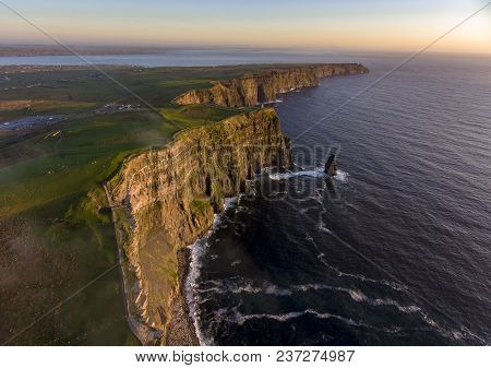 Beautiful Scenic Aerial Drone View Of Ireland Cliffs Of Moher In County Clare. Sunset Over The Cliff
