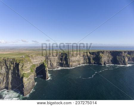 Beautiful Scenic Aerial Drone View Of Ireland Cliffs Of Moher In County Clare. Sunset Over The Cliff