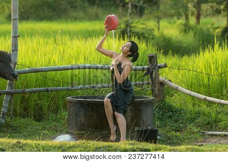 Asian Sexy Woman Bathing In Farmland At Location Countryside Of Thailand