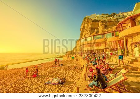 Azenhas Do Mar, Portugal - August 5, 2017: Tourists Sunbathing And Relaxing On Famous Beach Of Azenh