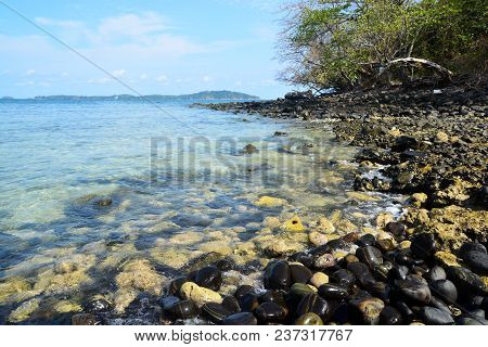 Koh Hin Ngam  Is A Unique Small Island Unlike Other Island. It's Covered With Small Black Rocks