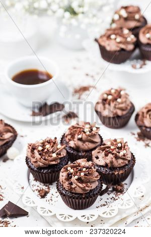 Chocolate Cupcakes Decorated Coffee Cheese Cream On A White Plate