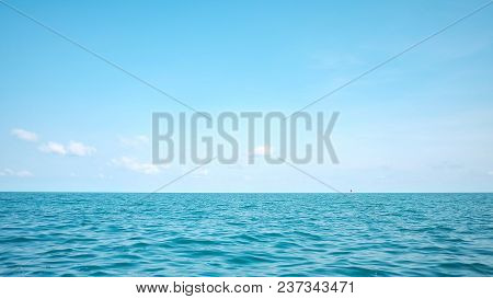 Deep Blue Sea With Water Waves And Horizon Line Against White Fluffy Clouds,deep Blue Sea In The Sou
