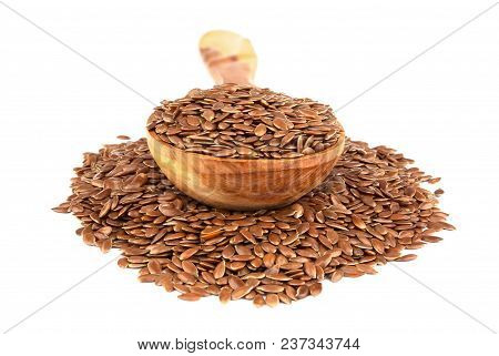 Flax Seeds In Wooden Spoon Isolated On White Background.  Also Known As Linseed, Flaxseed And Common