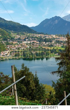 Aerial View Of The Small Town Of Levico Terme With The Lake And The Mountains. Trentino Alto Adige, 